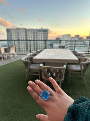 My Swiss blue topaz ring now fits beautifully.    The resized ring band and updated ring basket solved the fit issues.