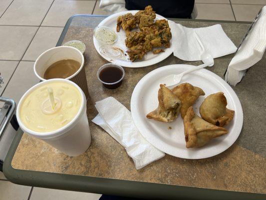 Deliciousness. I got the mango lassi, plate of pakora, and 4 veggie samosas with some chai tea