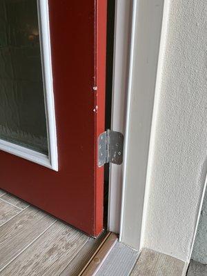 Front Door after delivery. Gentleman handling dolly states he did not feel the refrigerator hit the door.