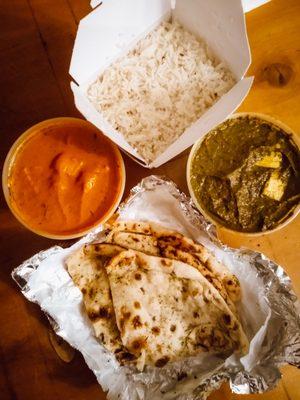 Garlic naan, chicken tikka masala, and saag paneer.