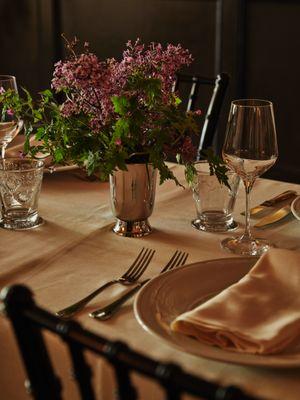 Reception dining set-up with custom florals