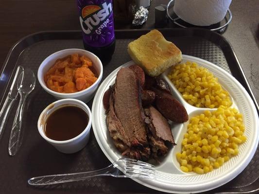 Two meat plate with two sides and a bread item.