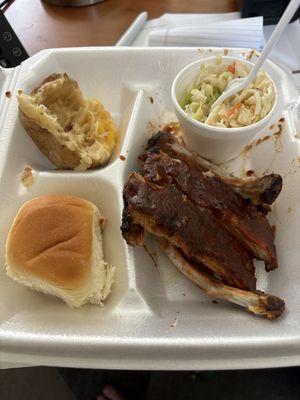 1-4 rack ribs with mild sauce, twice baked potato, Slaw and dinner roll.