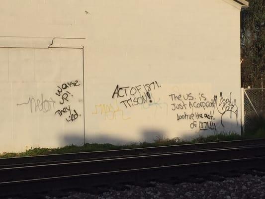 Someone needs to learn how to spell. Building across from the tracks.