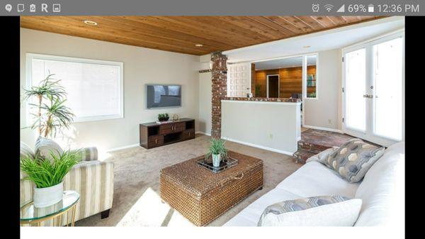 Picture of what the family room look like before remodel, brick foyer, half wall blocking access.