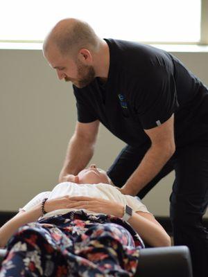 Dr. Allin adjusting one of our patients