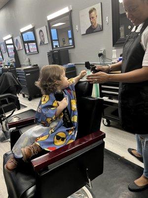 Simone was so patient with our little dude and made sure he was comfortable with the tools before his haircut started.