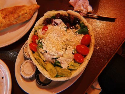 Green salad in a breadbowl