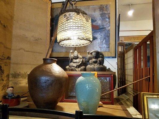 Intriguing lamp, stone figurines and vases