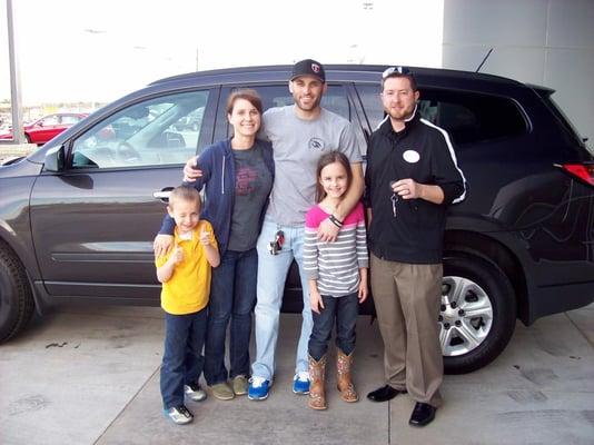 A Tyler family getting their keys to their brand new Traverse!