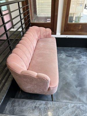 Super fun couch where you can wait if you arrive early for your appointment.