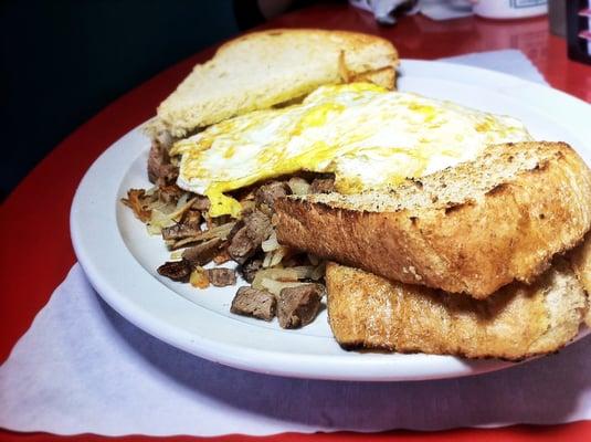 Roast Beef Hash: Shredded Roast Beef sauteed with Onions & Potatoes, served with Eggs, Toast, American Fries w/ Grilled Onions.