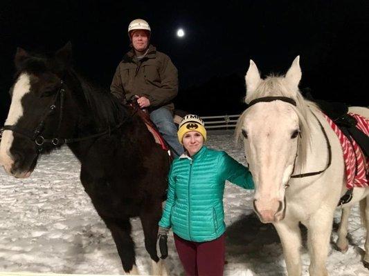 Riding at night under moonlight in the outdoor ring.