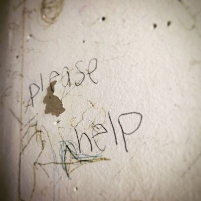 graffiti seen in classroom: "please help"