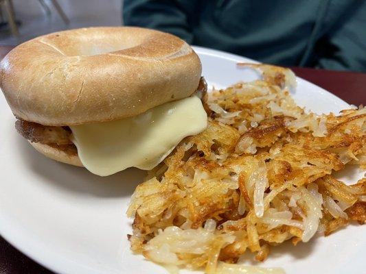 Breakfast sandwich with has browns.