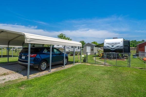 Elite site with carport, shed, and fenced yard