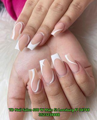 Elegant white French tips with delicate lines on coffin-shaped nails