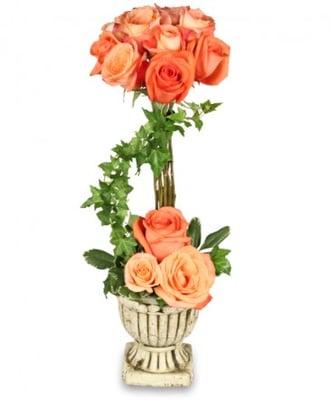 This rose topiary can be made in any color roses and comes in a Grecian container.