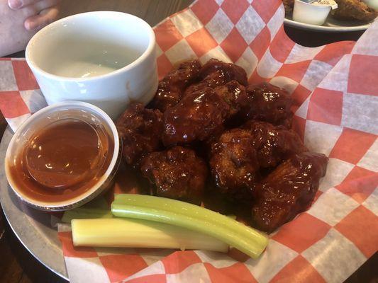 Bbq wings with a side of Buffalo Sauce.