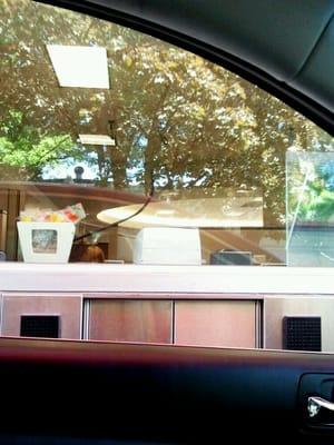 It's a drive-thru teller! Yes, as in a live, human teller. Trippy.