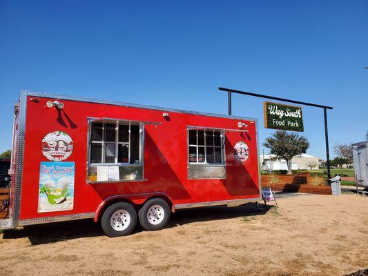 Red trailer right next to kitchen