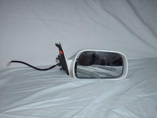 New or used side mirrors installed or for resale.