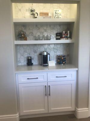 With this Beautiful backsplash and white Cabinets, Coffee in the morning should be a delight