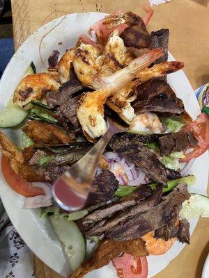 Served on a bed of lettuce, tomato, cucumber,. Grilled, fresh, breaded, bacon wrapped shrimp, octopus, and juicy fajita.