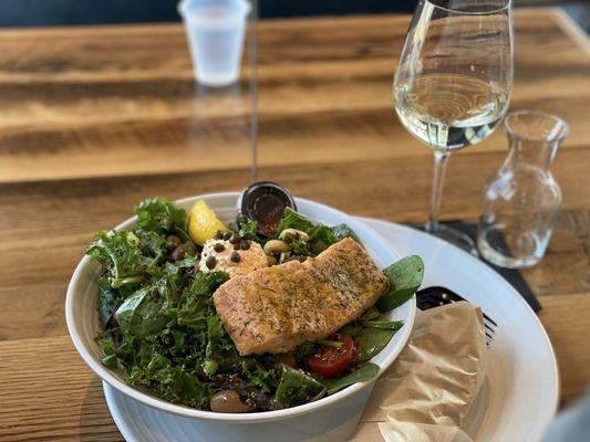 Mediterranean salmon bowl with a side of wheat wrap + white wine