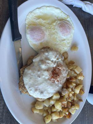 Chicken fried steak and eggs.