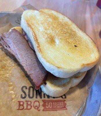 Sliced Brisket Sandwich on Garlic Bread