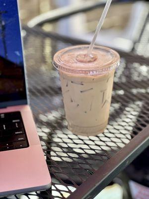 Iced Decaf Oat Milk Latte on the back deck.