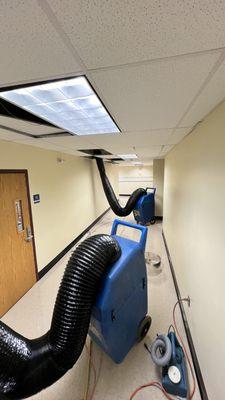 Powerful negative air machines at work to clean middle school in scotch plains .