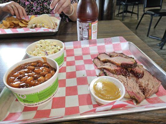 Brisket platter with slaw and baked beans.