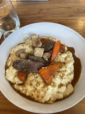 Pork cheeks with cheese polenta with carrots and parsnips