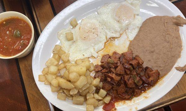 Huevos rancheros with country sausage! So good. Nice big plate!