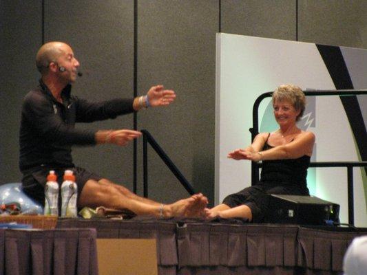 On stage with my mentor, Lawrence Biscontini. Being a model for fitness is a hard job.