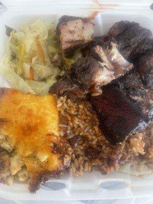 Jerk Pork, Rice and Peas, cabbage, Mac and Cheese