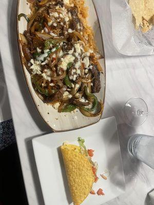 Steak fajita rice and side taco