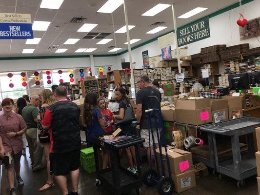 Sunday afternoon is a busy day to bring books by to sell. Still, they promised to get to ours in under an hour.