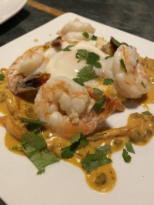 Shrimp with poached egg over grits