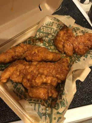 Mango habanero chicken tenders - sweet and really hot - so good! Even though they look overbreaded they absolutely are not with tons of meat