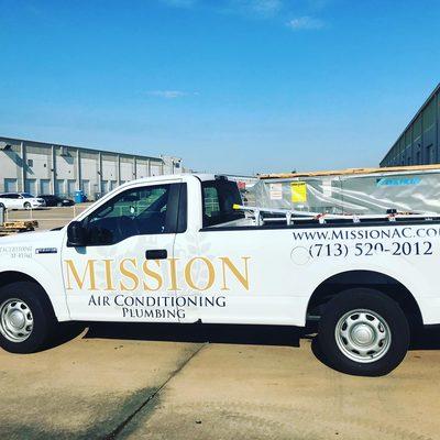 Mission company truck delivering new AC unit