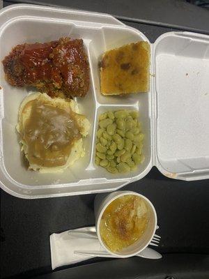 Meatloaf mashed potatoes with gravy green lima beans and cornbread I'll save some peach cobbler