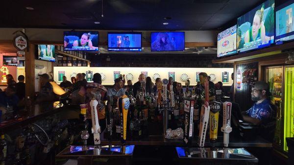 Owner (Chris on the right) and large bar area.