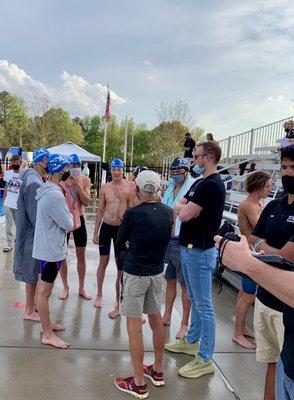 Olympian Jack Conger & Jack Roach talk to swimmers in 200 Fly