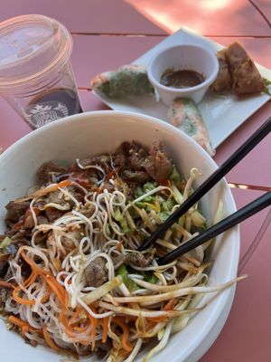 Shrimp spring rolls and vermicelli with pork and egg roll.