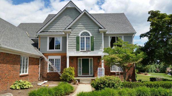 Beautiful new windows and Hardie Board siding along with wood rot replacement