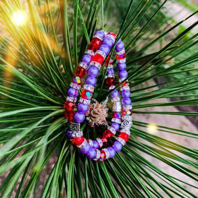 7.5 inch bracelet with 8 mm purple glass beads and silver spacers