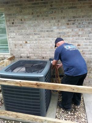 Mr Gym installing a new 4-ton 16seer Condneser